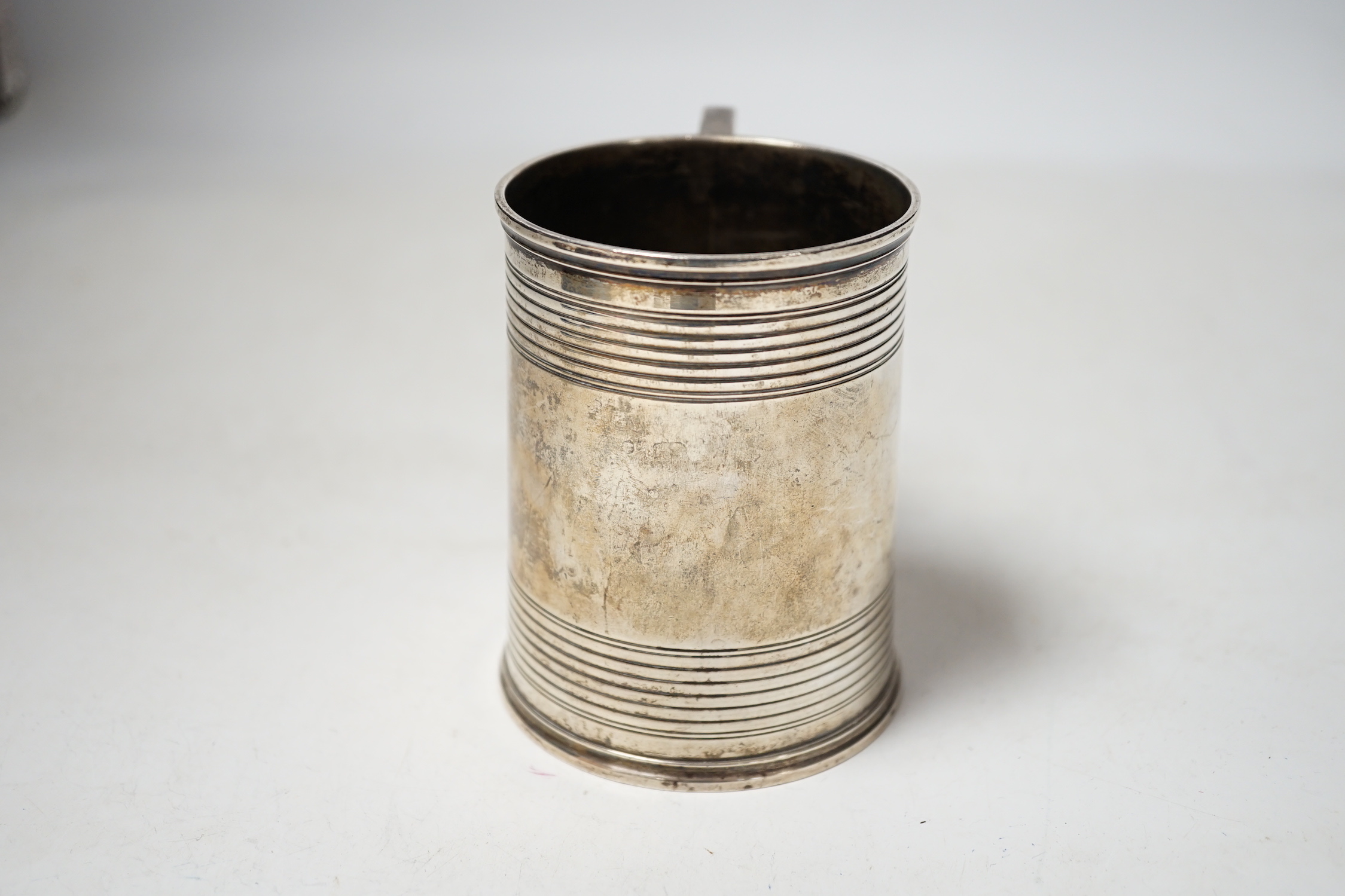 A Victorian reeded silver christening mug, Edward Charles Brown, London, 1868, 94mm.